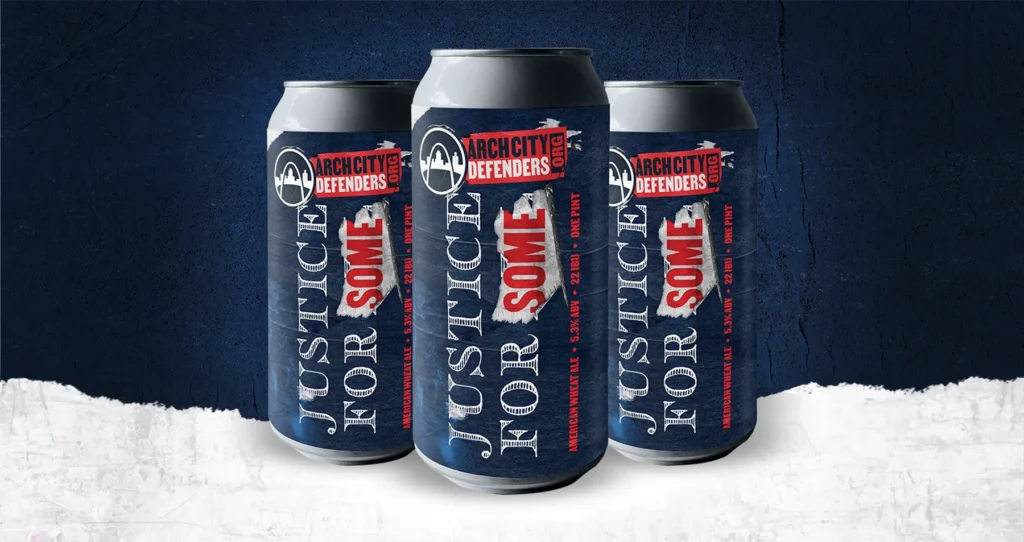 Three cans of ArchCity Defenders’ beer labeled "Justice for Some," with a dark blue and red design.